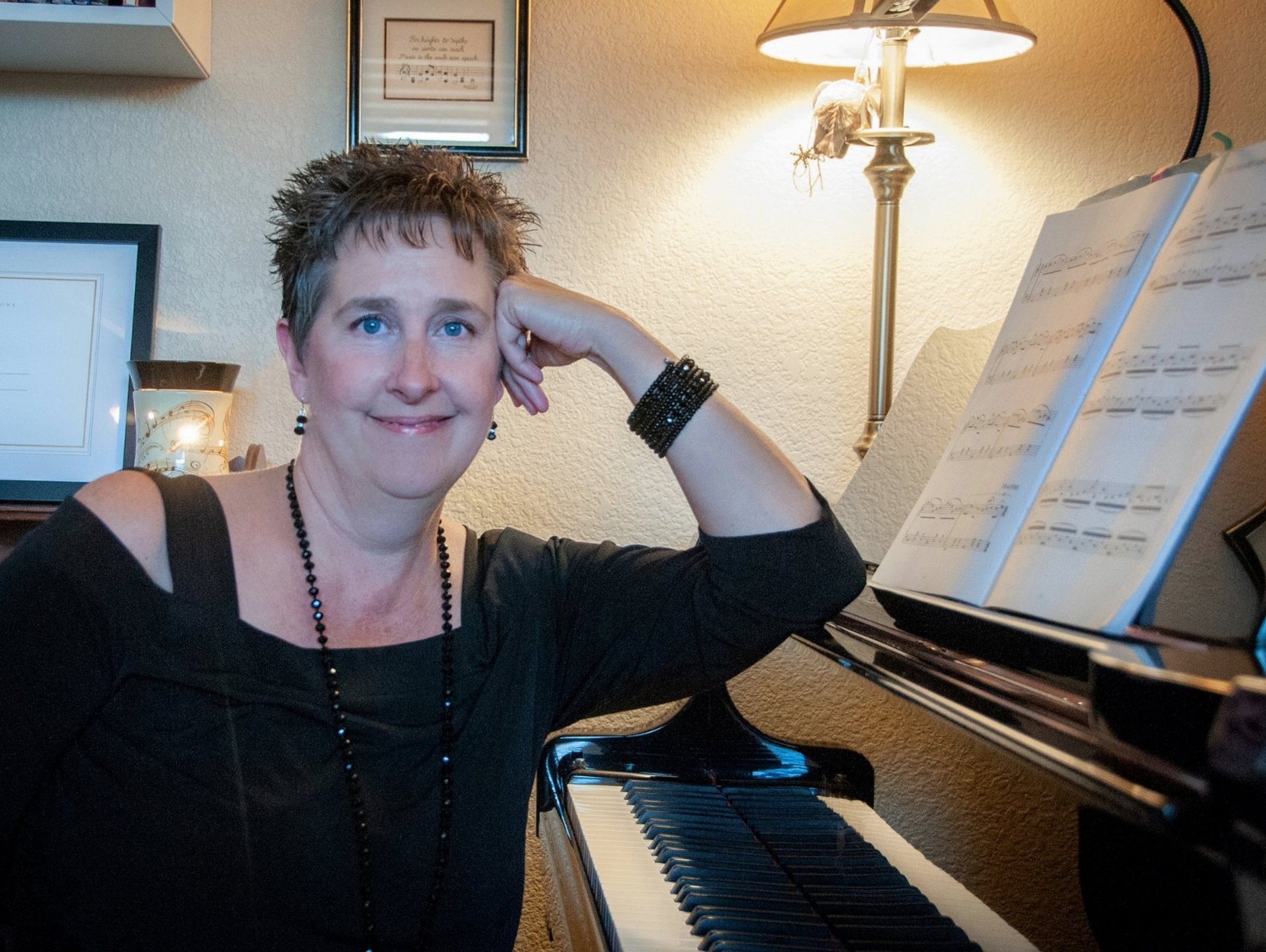Diana Bluebaugh at the piano in her Keys 4 Life Piano Studio in Monument, Colorado